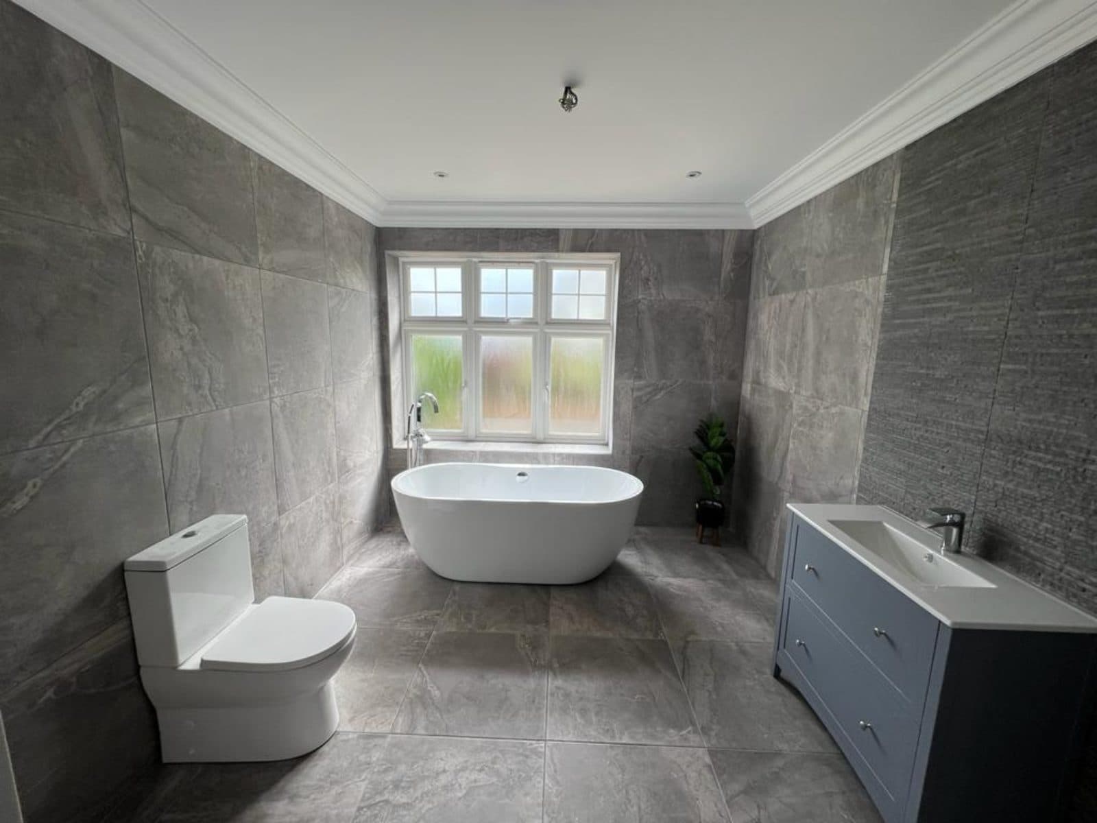 Finished bathroom with a freestanding bath