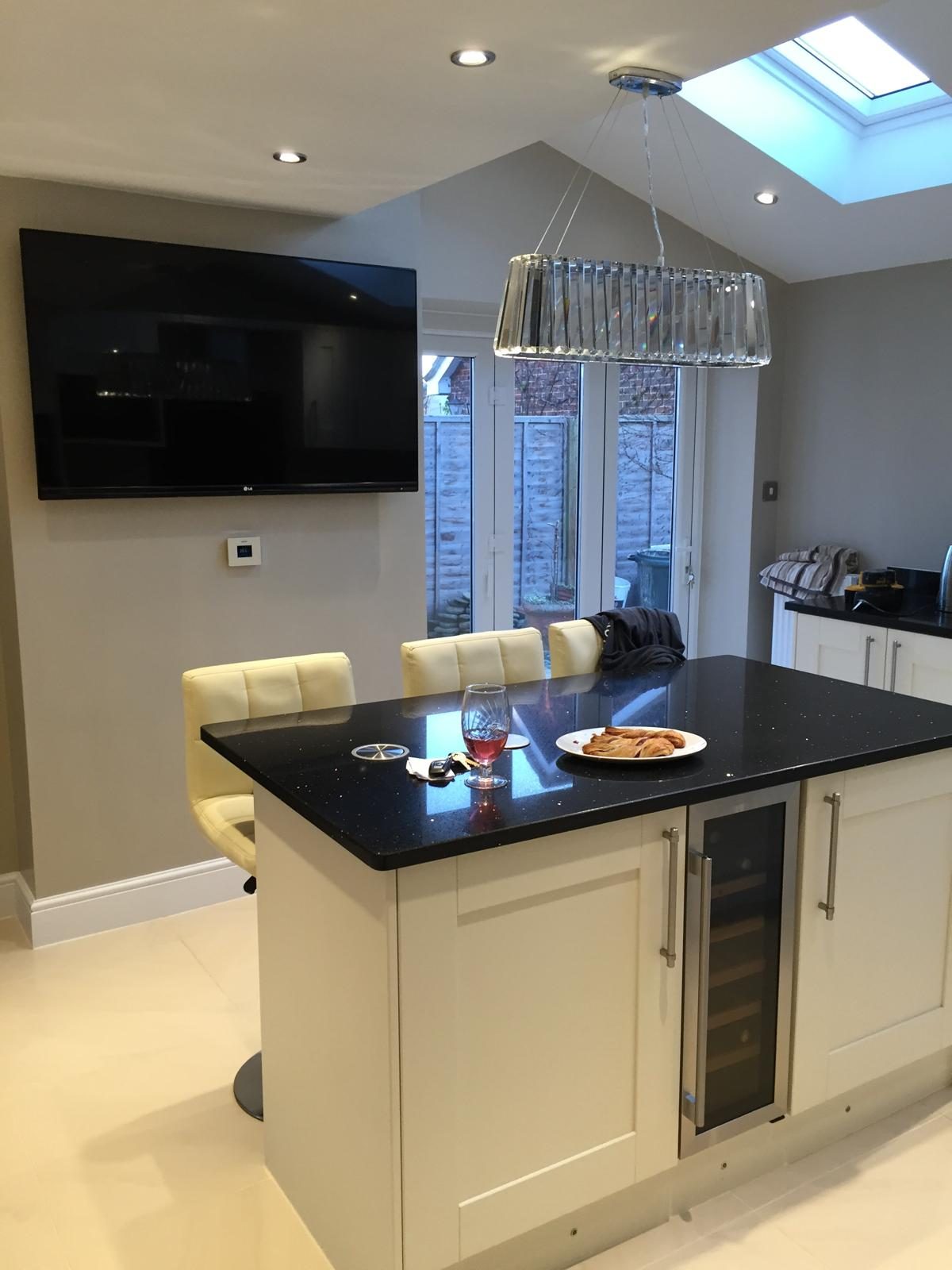 New kitchen with an island after a knock through