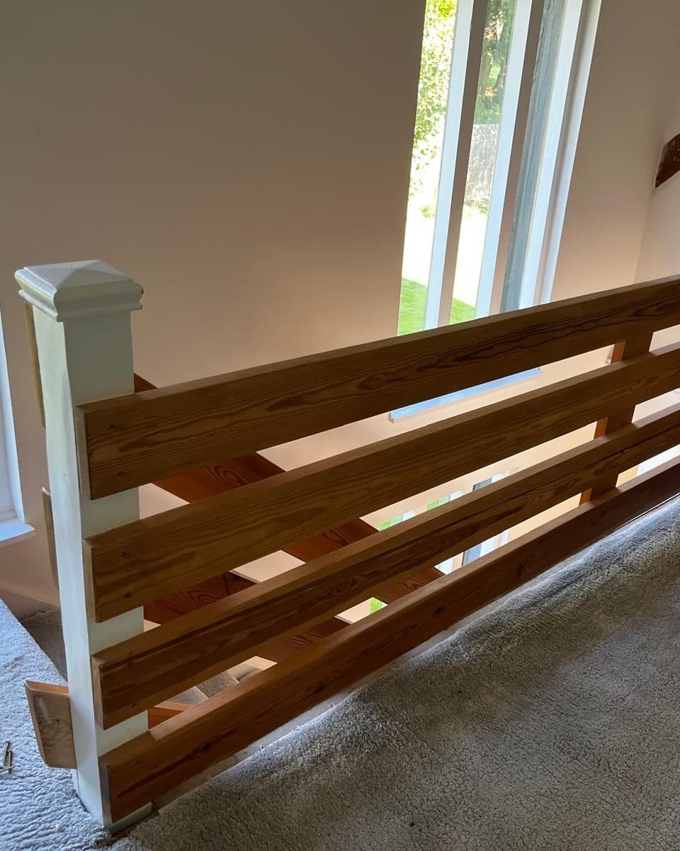 The landing before, guarded by four horizontal pine boards