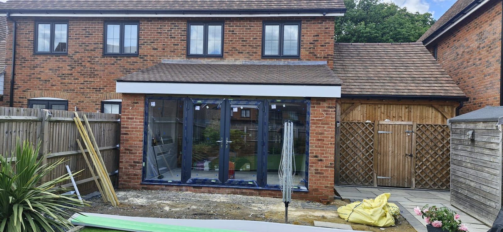 Single storey extension with bifolds, photograph 9